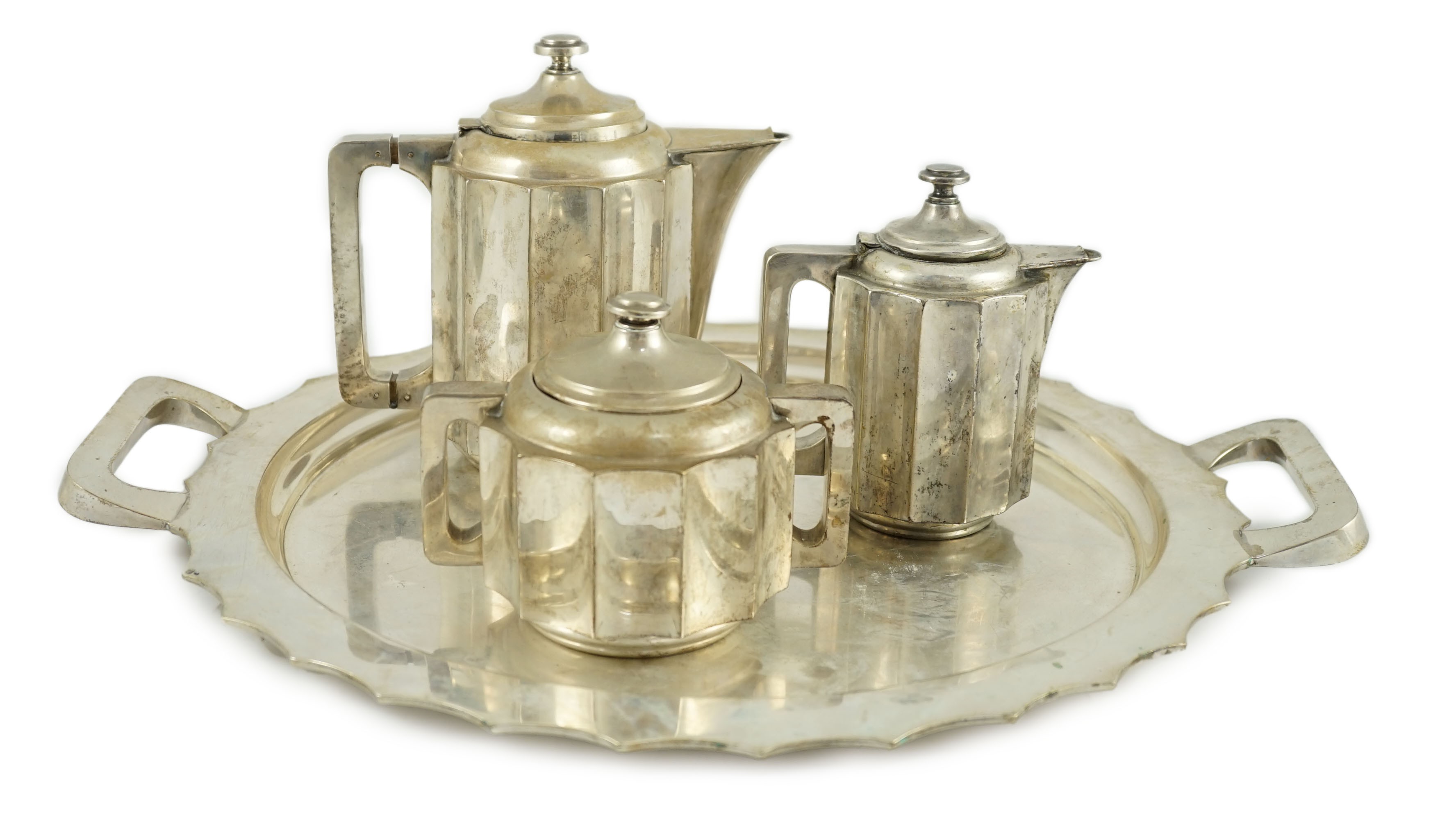 A 20th century Portuguese Art Deco three piece 833 standard silver tea set with two handled tea tray